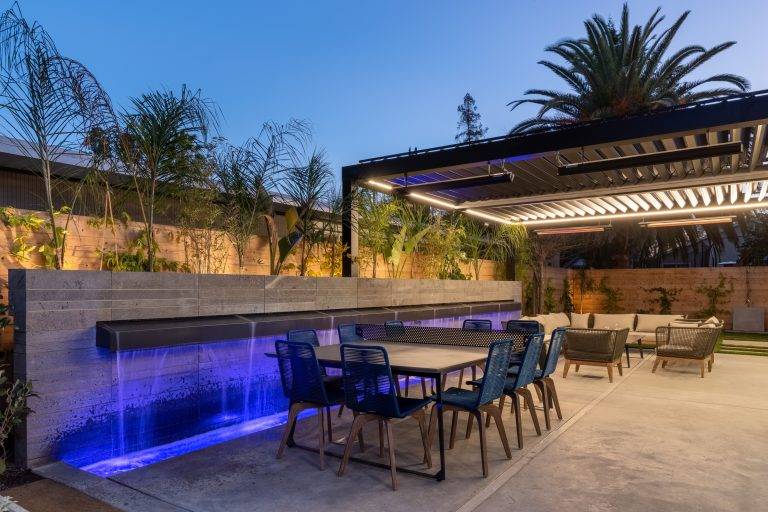 The backyard features a 35-foot-wide waterfall wall. Photo by Boaz Meri courtesy VRchitects.